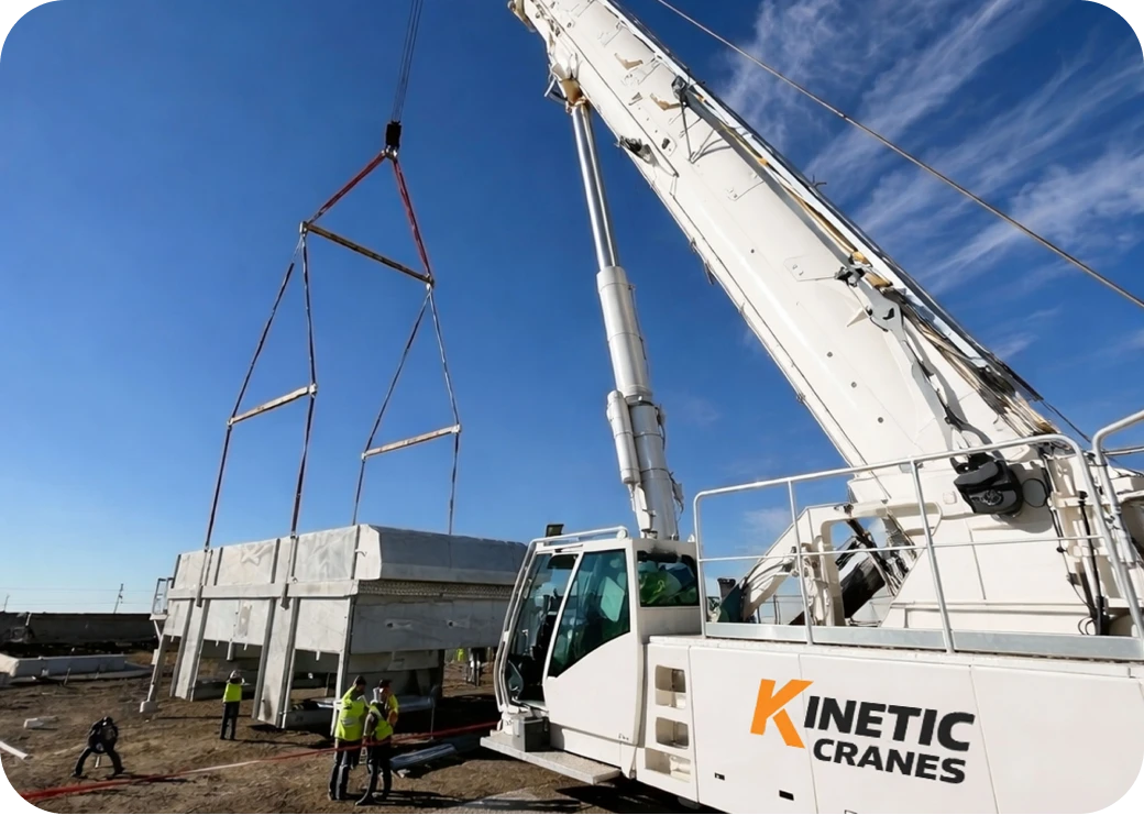 Workers guiding crane lift operation