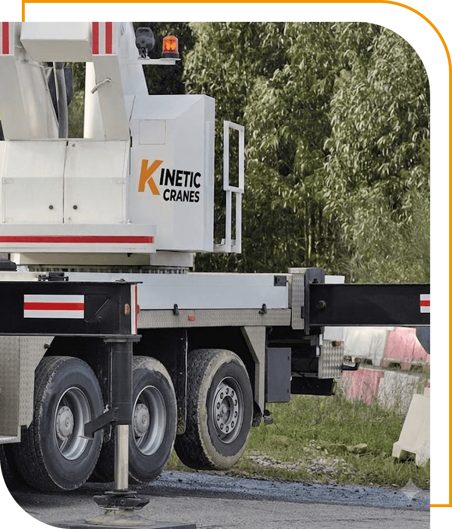 Crane truck with stabilizers on roadside.